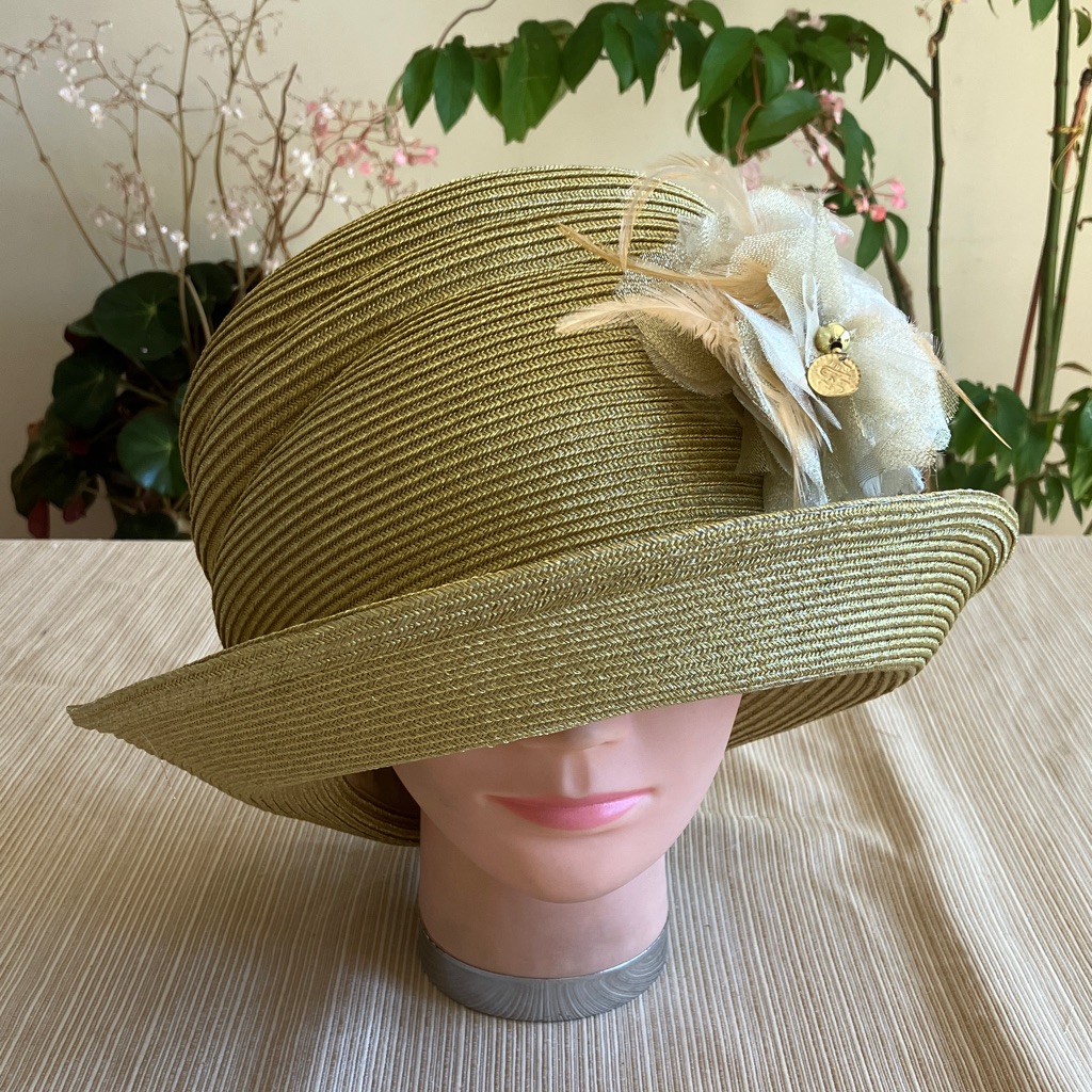 Elegant Metallic Gold Cloche Hat With Cream Golden Floral Accent
